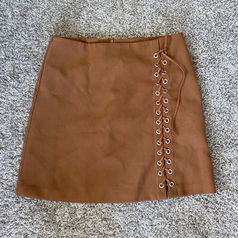 Brown mini skirt. First sizes 4-6. Never worn before